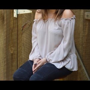 off the shoulder light pink shirt